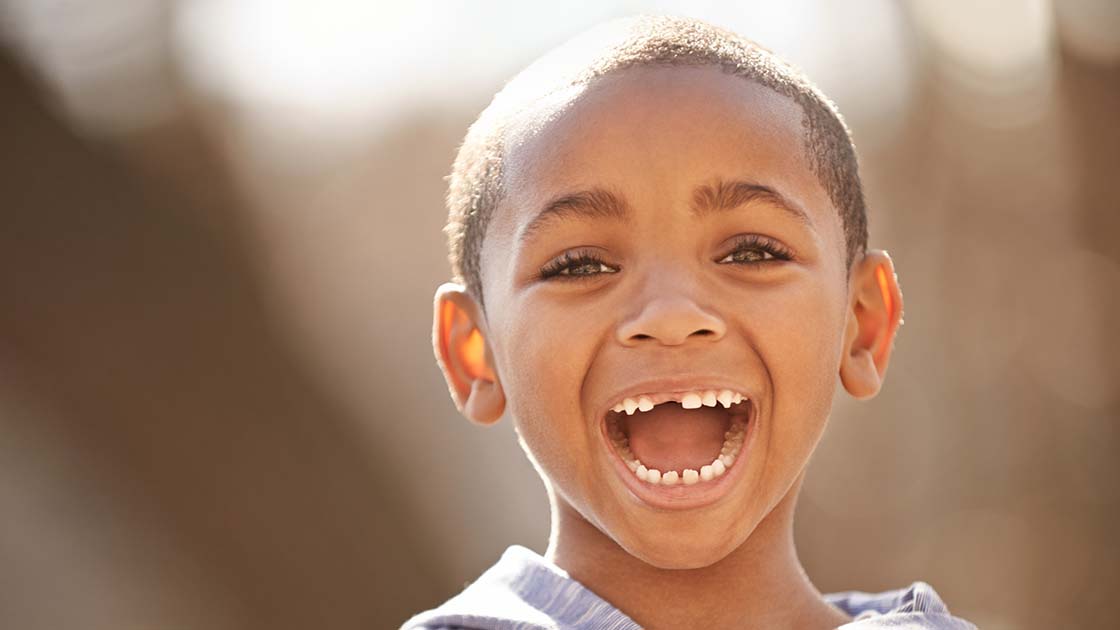 Smiling Boy in Sunshine