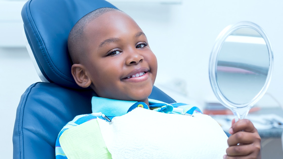 Boy Smiling in Mirror